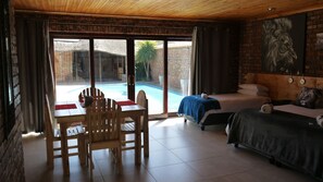 Luxury Quadruple Room, 1 Bedroom, Pool Access, Pool View | Premium bedding, individually decorated, individually furnished, desk - The Bay Inn (Gqeberha (Port Elizabeth))