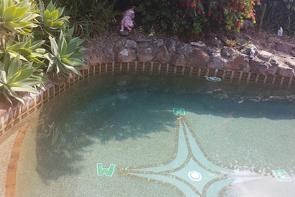 Outdoor pool, open 9 AM to 10 PM, pool umbrellas