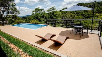 Outdoor pool, pool umbrellas, pool loungers