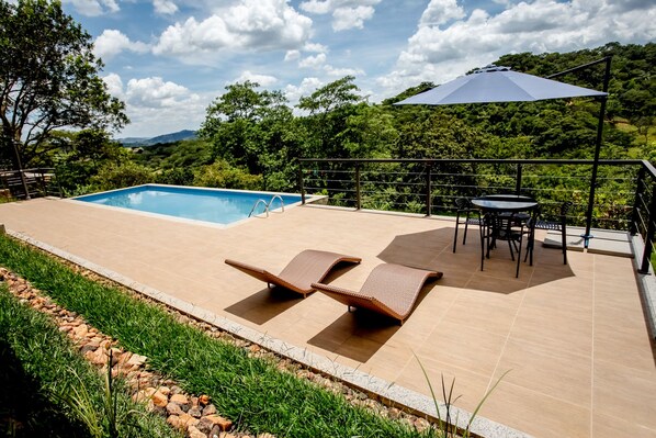 Outdoor pool, pool umbrellas, pool loungers