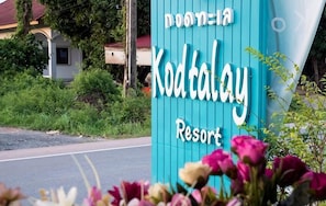 A sign for Kodatalay Resort with a blue background and white lettering.