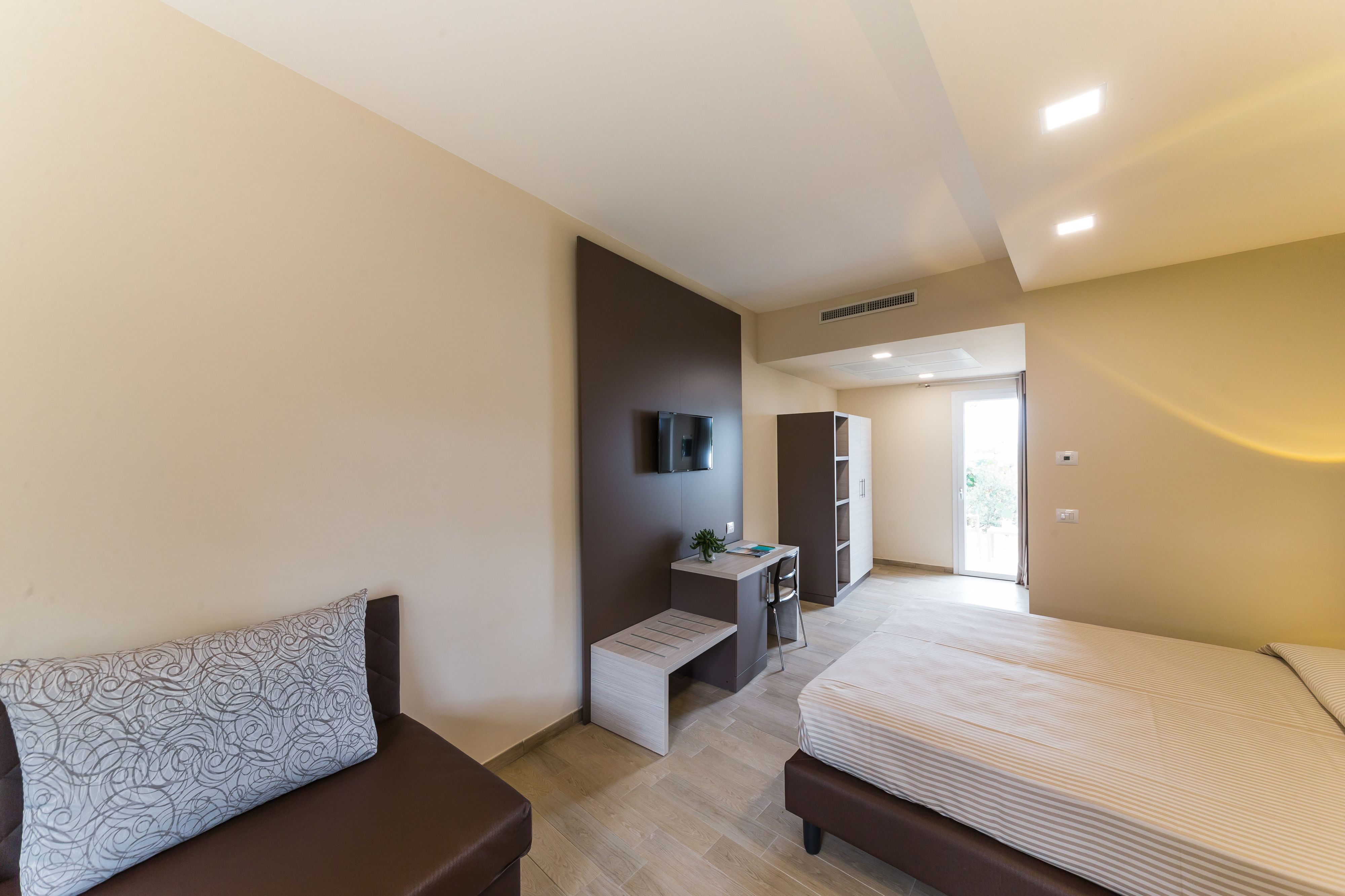 family room | 1 bedroom, premium bedding, minibar, in-room safe