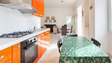 Standard Apartment, 3 Bedrooms | Private kitchen | Full-sized fridge, oven, stovetop, cookware/dishes/utensils