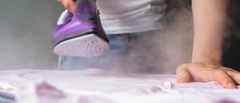 A person ironing a garment.