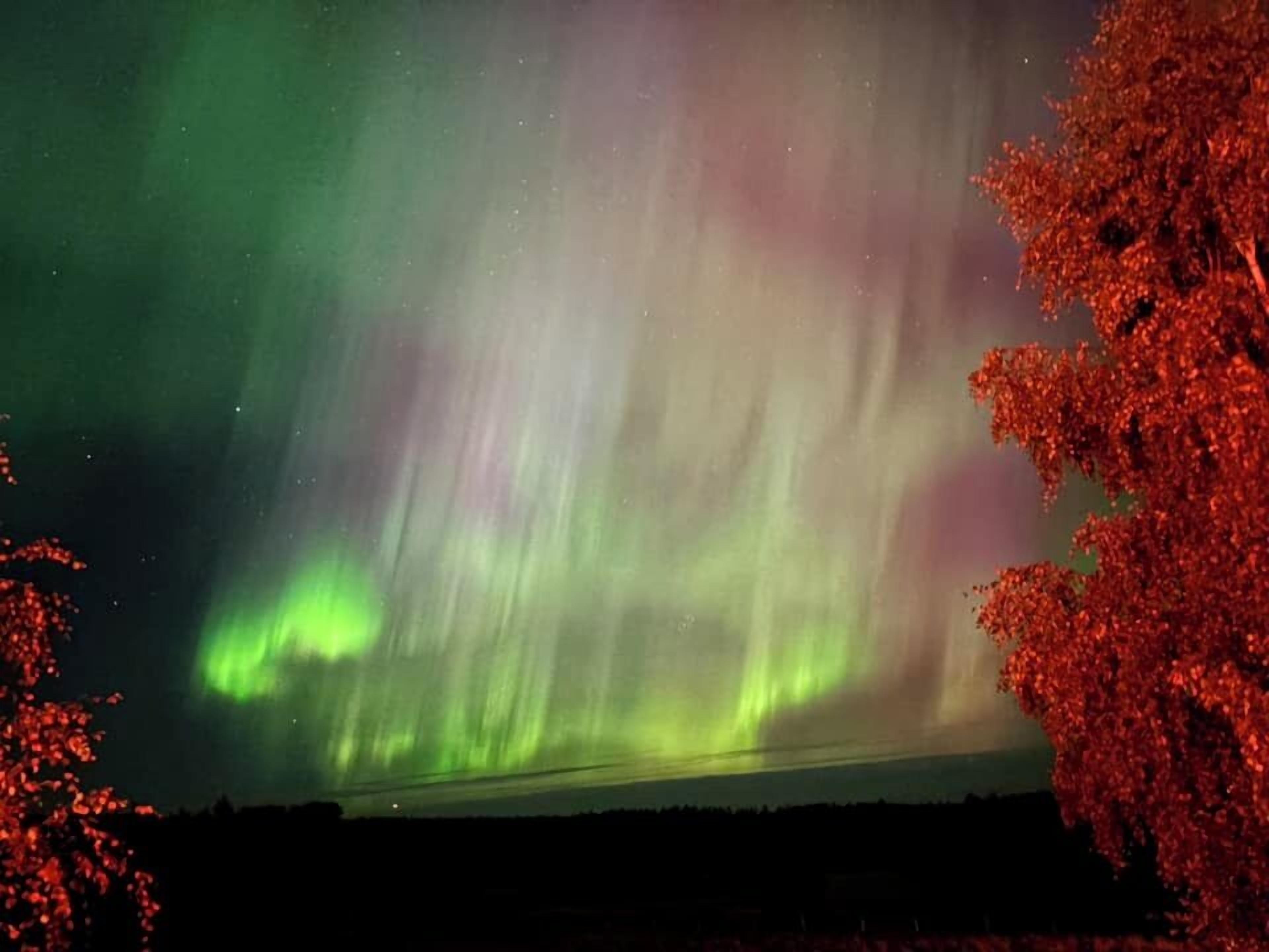 A night sky with the aurora borealis.