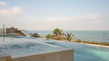 Outdoor pool, open 9:00 AM to 9:00 PM, pool loungers