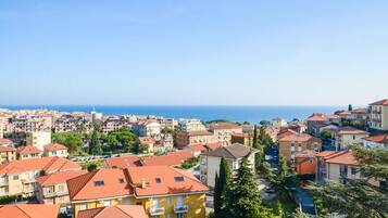 Apartment, 1 Bedroom, Balcony, Sea View | 1 bedroom, in-room safe, desk, free cribs/infant beds