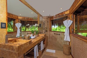 Shower, free toiletries, slippers, towels