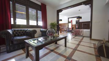 Deluxe suite | Woonruimte | Een flatscreentelevisie en betaalfilms