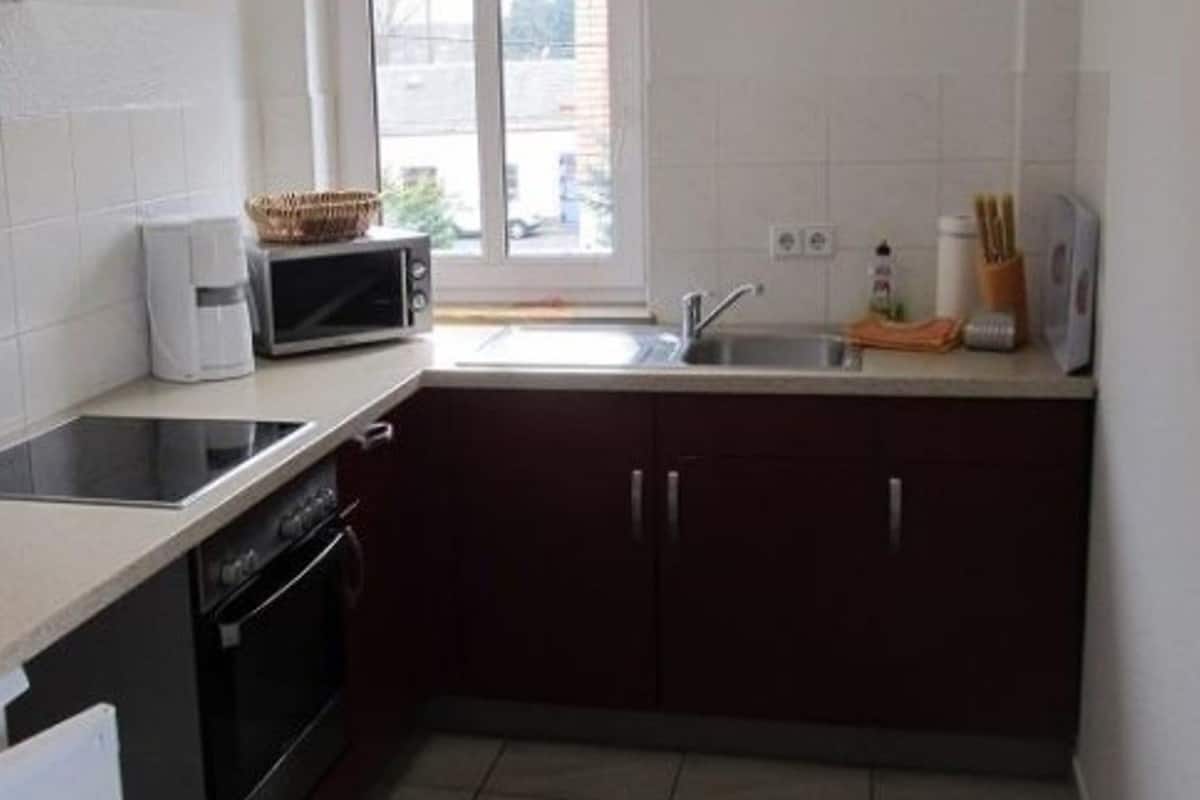 Departamento | Cocina privada | Horno, parrilla de estufa, cafetera y tetera y utensilios de cocina