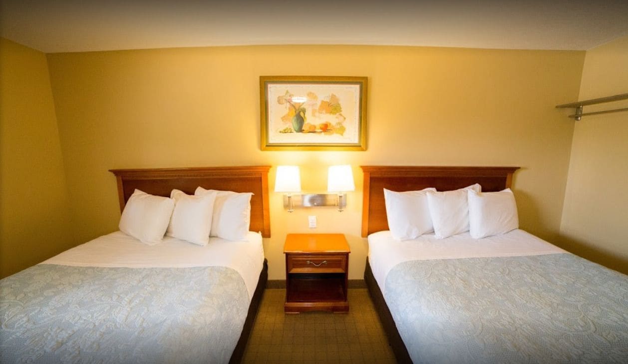 Room, 2 Queen Beds | Blackout curtains, free WiFi, bed sheets