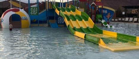 A water park with slides and a play structure.