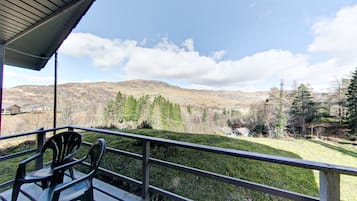 Enjoy breathtaking views of the surrounding mountains from this balcony.