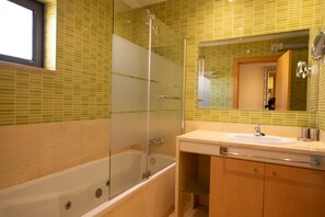 Bathtub, hair dryer, bidet, towels