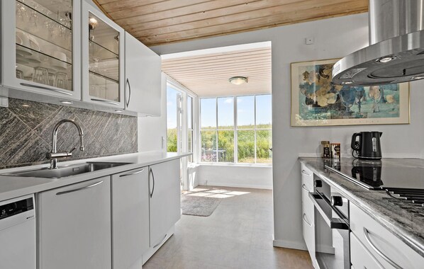 Fridge, stovetop, dishwasher, coffee/tea maker