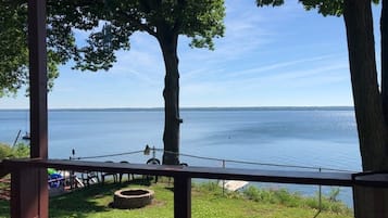 Enjoy serene lakeside views from this peaceful outdoor space, perfect for dining or relaxation.