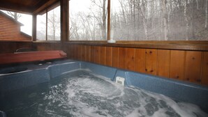 A hot tub with a wooden interior and a view of a forest through a large window. - Excellent Mountain View’s, Hot Tub, WIFI, Minutes to Gatlinburg (Gatlinburg)