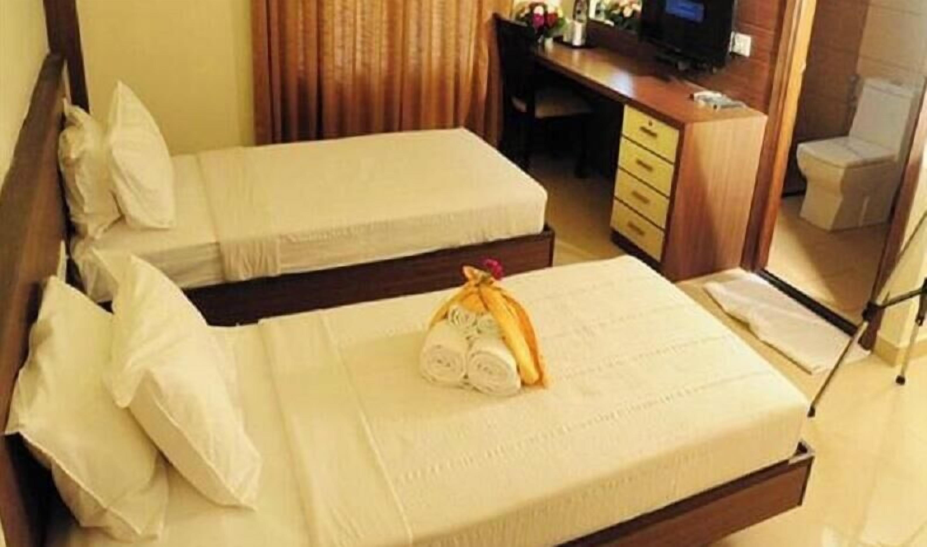 Premium bedding, desk, laptop workspace, soundproofing