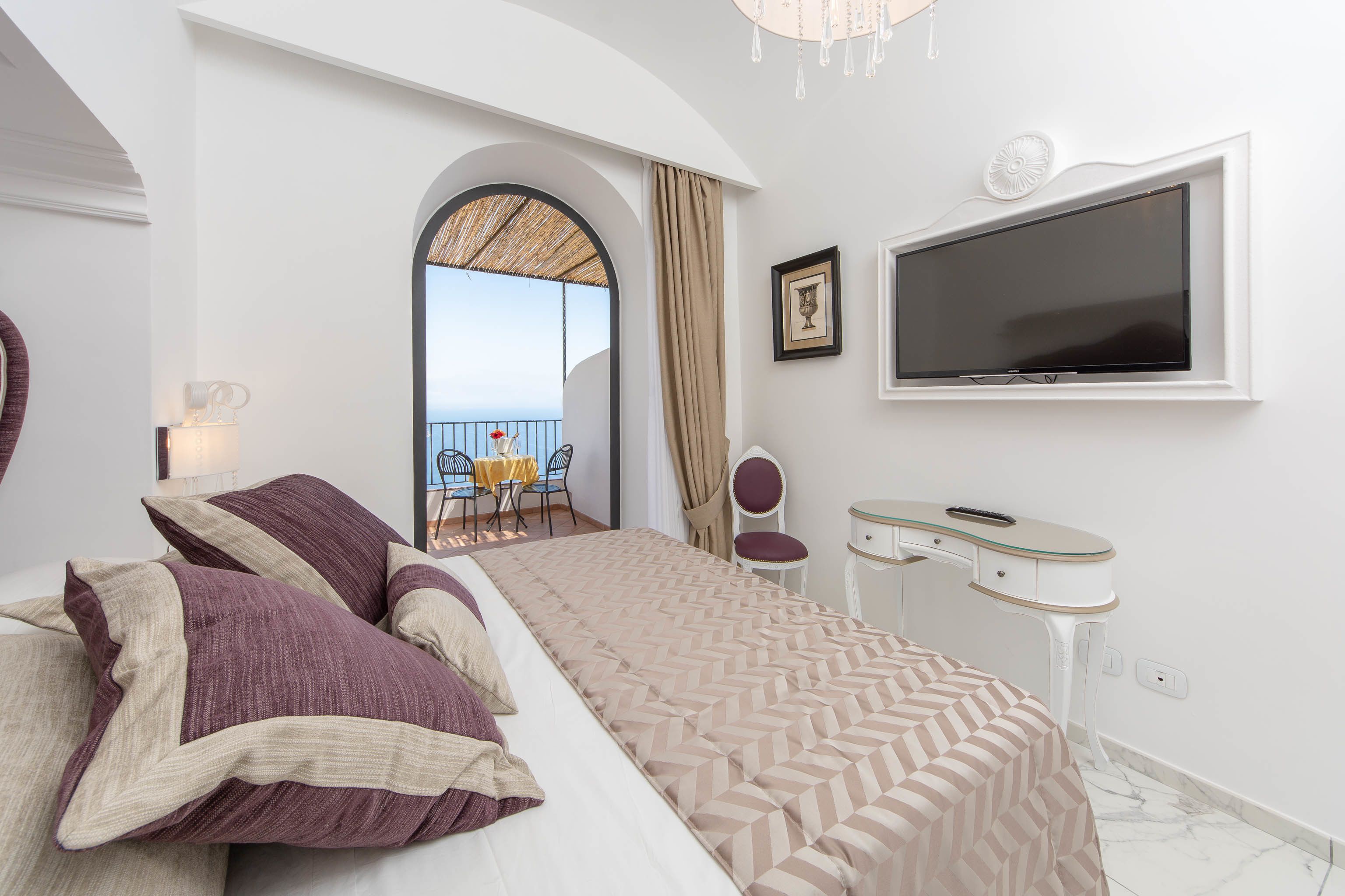deluxe double room, balcony, sea view | premium bedding, minibar, in-room safe, individually decorated