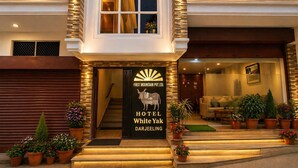 A hotel entrance with a sign reading 'First Mountain Pvt. Ltd. Hotel White Yak Darjeeling.' - Hotel White Yak (Darjeeling)