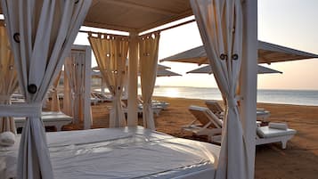 Private beach, beach umbrellas, beach towels, scuba diving