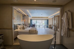 Signature Suite | Bathroom | Deep soaking tub, rainfall showerhead, free toiletries, hair dryer