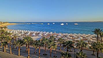 Private beach, beach umbrellas, beach towels, scuba diving