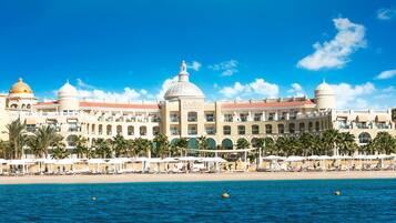 Private beach, beach umbrellas, beach towels, scuba diving