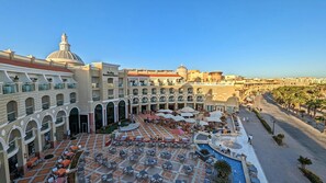 A resort with a central courtyard, outdoor seating, and a swimming pool. - KaiSol Romance Resort (Sahl Hasheeh)
