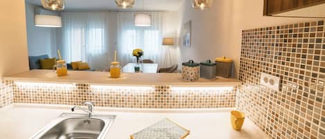 Fridge, stovetop, electric kettle, toaster