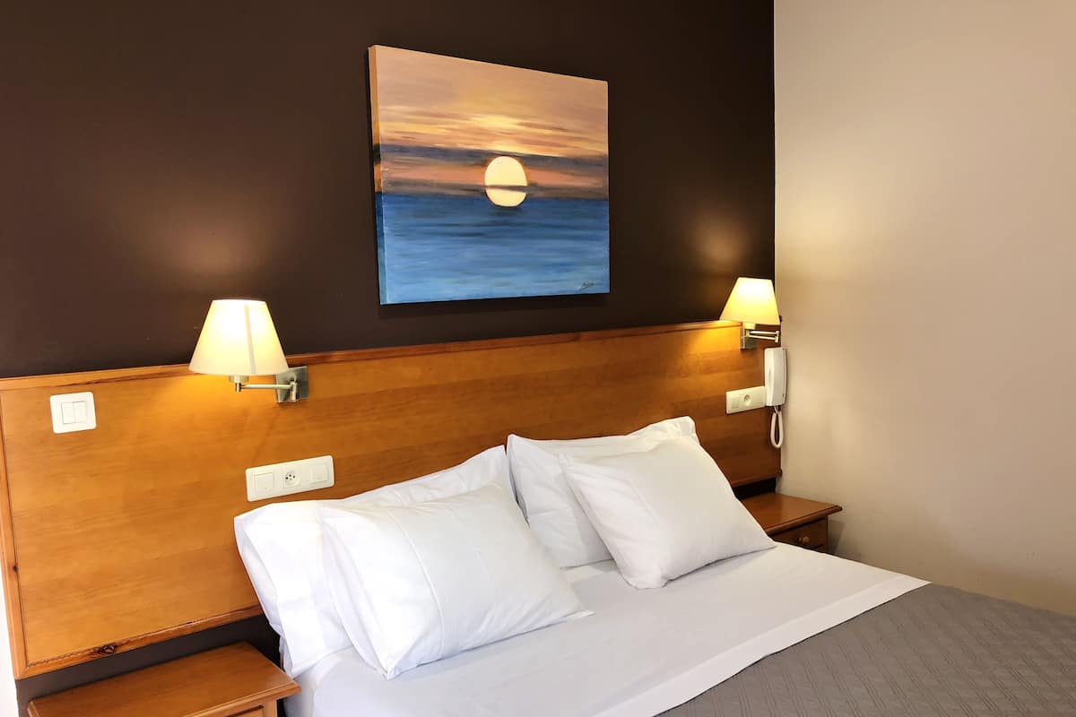 Premium bedding, memory-foam beds, in-room safe, desk