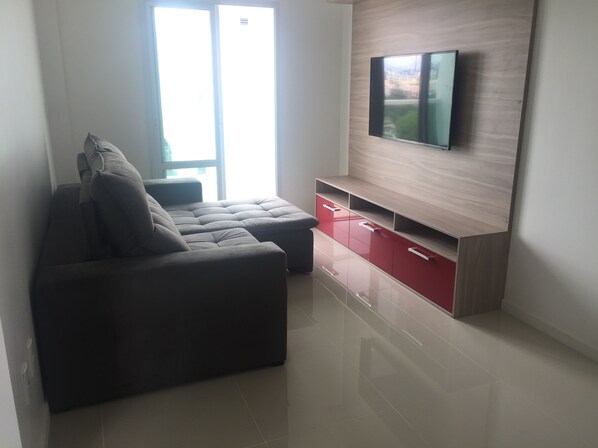 Family Double Room Single Use, 2 Bedrooms, City View | Living room | 49-inch LED TV with cable channels, TV