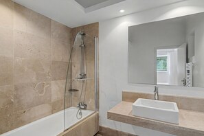 Shower, hair dryer, towels, toilet paper
