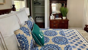 A bedroom with a bed, a dresser, a mirror, and a closet. - Bear House 1890, Lilly's Loft, Delightful, Upgraded amenities, Walk to Cafes (Chattanooga)