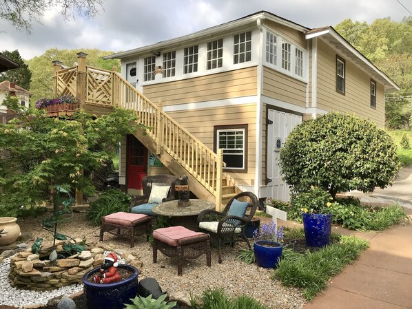 A two-story house with a wooden deck, a red door, and a welcome sign. - Bear House 1890, Lilly's Loft, Delightful, Upgraded amenities, Walk to Cafes (Chattanooga)