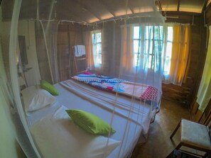 A room with two beds, each with a mosquito net, and a chair. - Plantation Retreat (Pathadumbara)