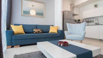 Apartment, 2 Bedrooms, City View, Tower | Living area | 40-inch flat-screen TV with cable channels, TV