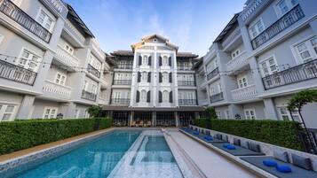 Outdoor pool, open 6:30 AM to 9:00 PM, pool loungers