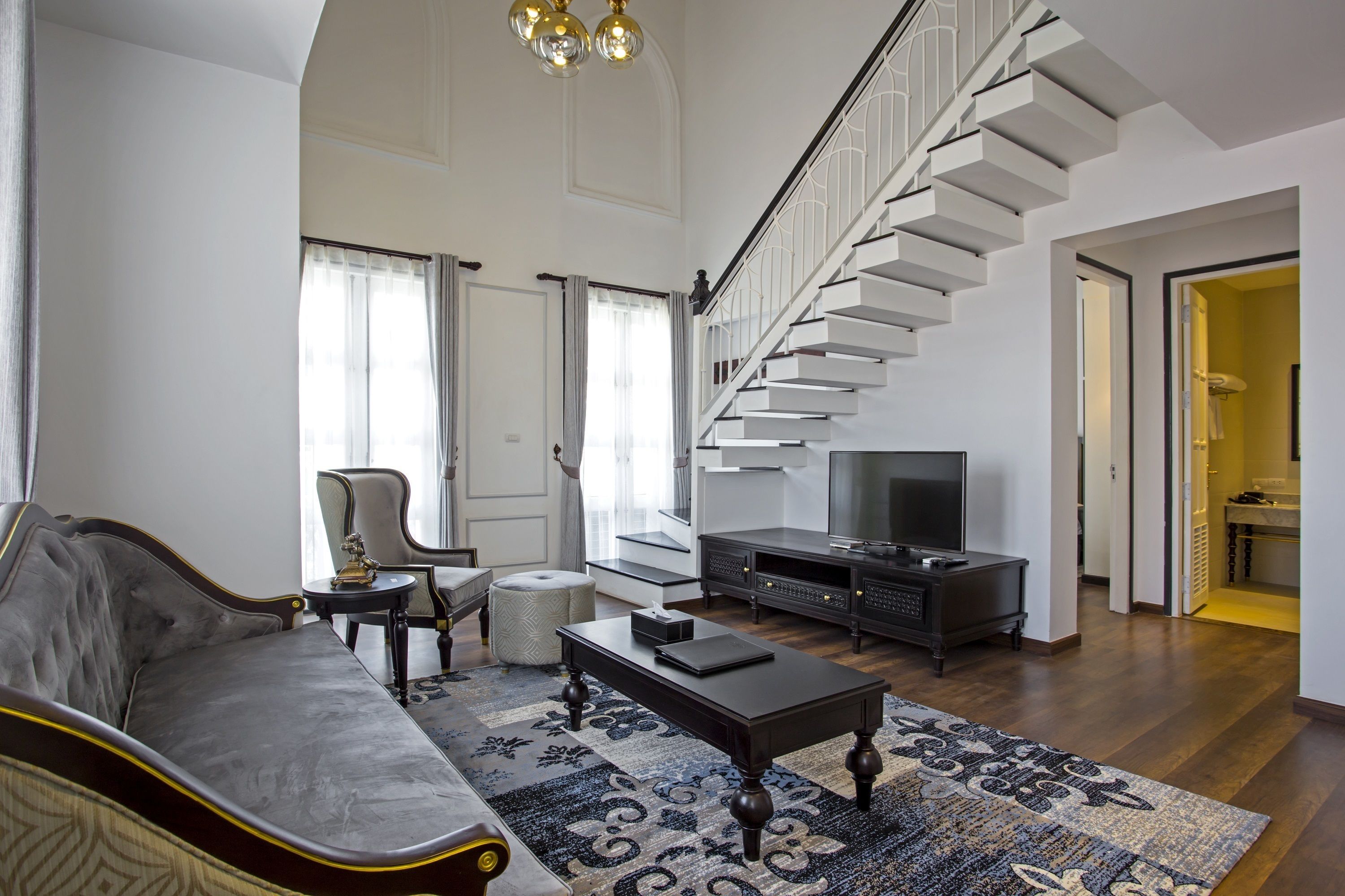 le thatluang suite | living area | flat-screen tv