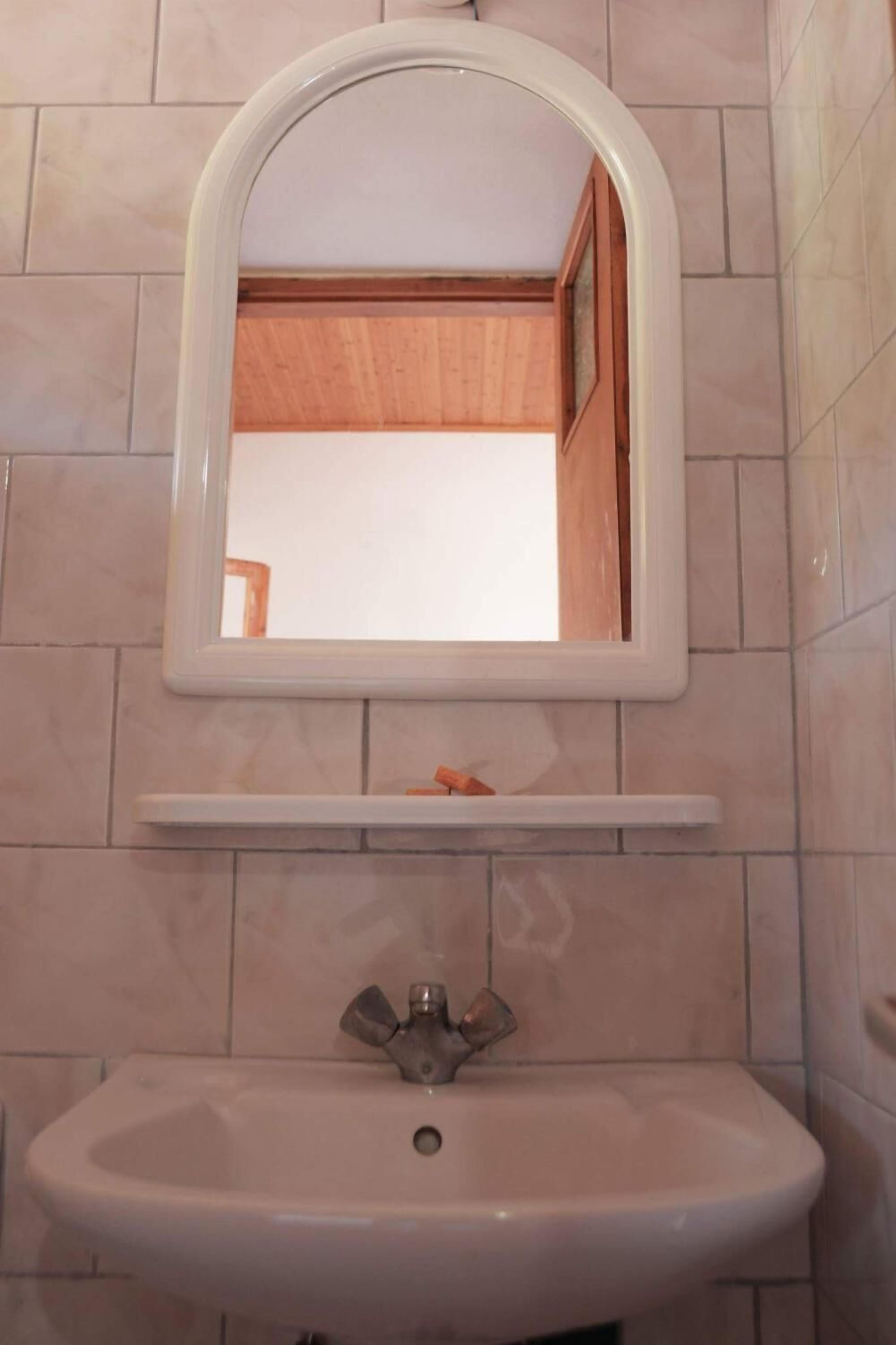 designer toiletries, hair dryer, towels