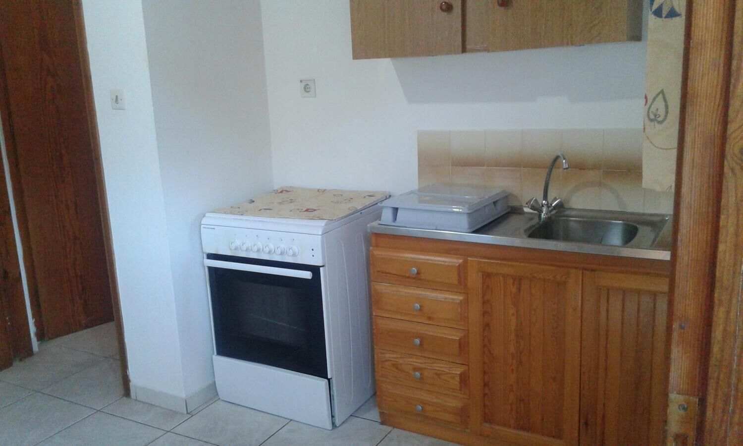 full-sized fridge, blender, cleaning supplies, paper towels