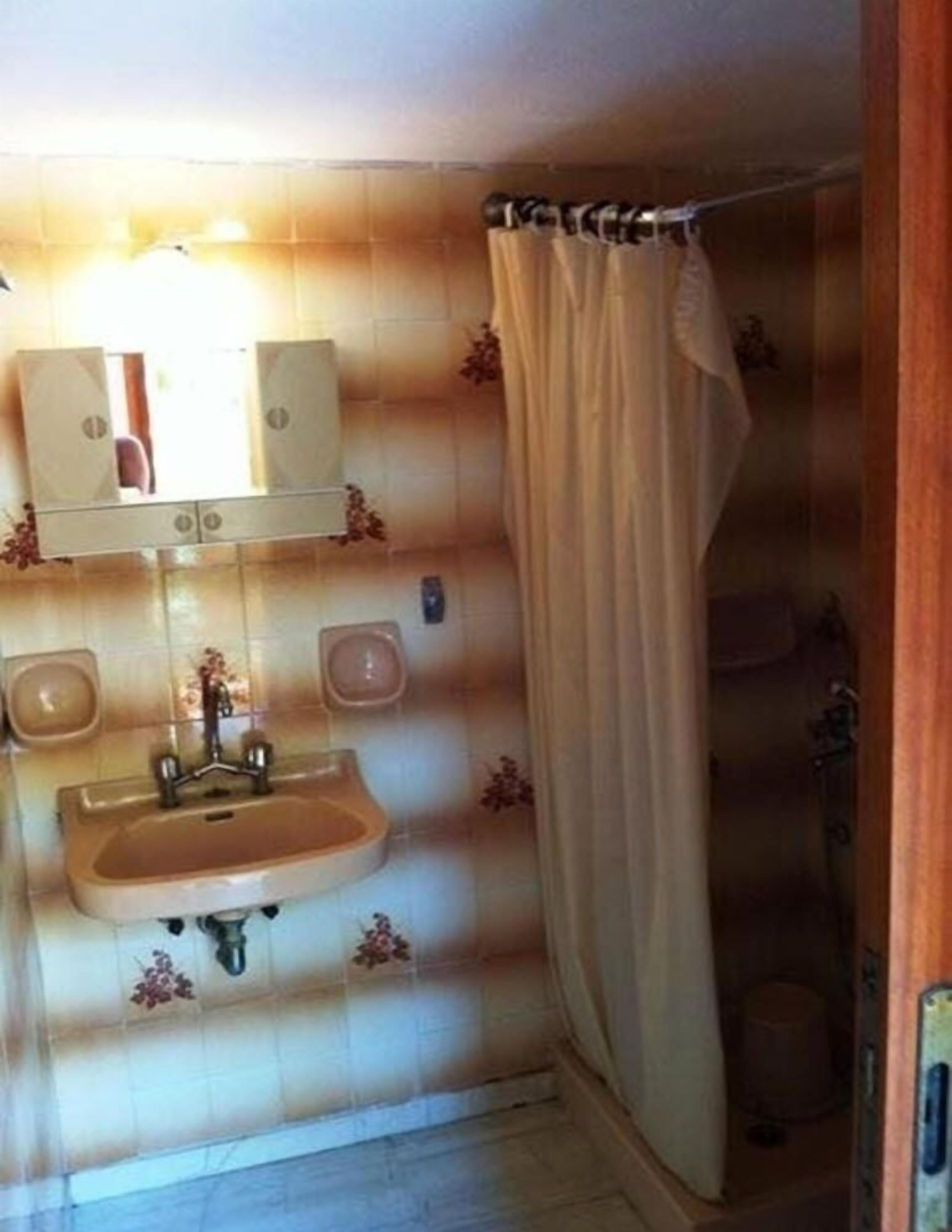 designer toiletries, hair dryer, towels