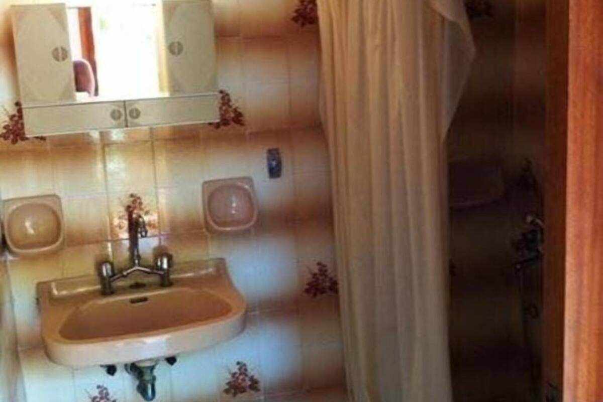 designer toiletries, hair dryer, towels