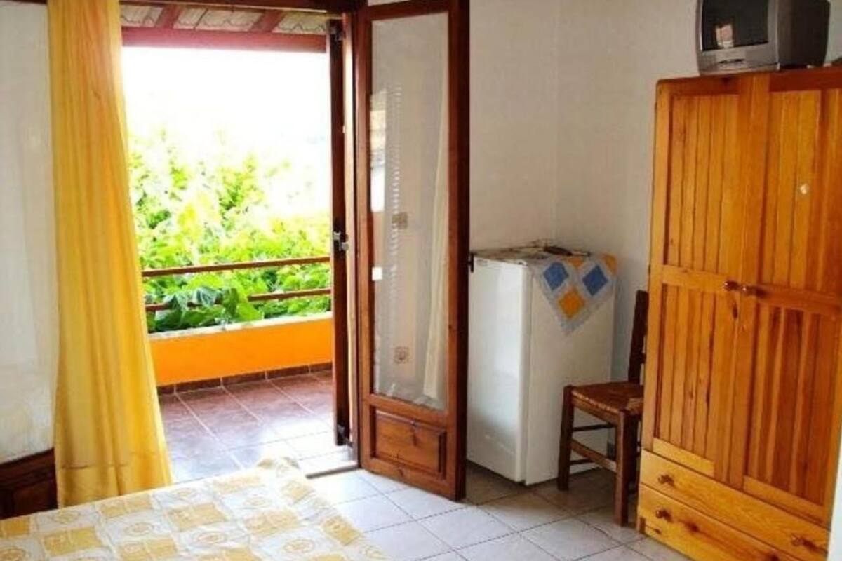 quadruple room, garden view | individually decorated, individually furnished, blackout curtains