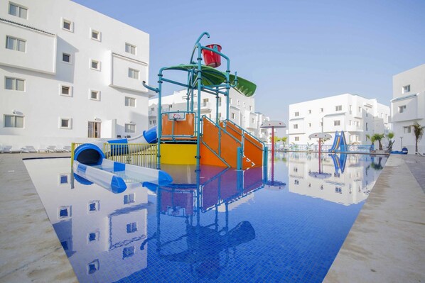 Outdoor pool, pool umbrellas, sun loungers