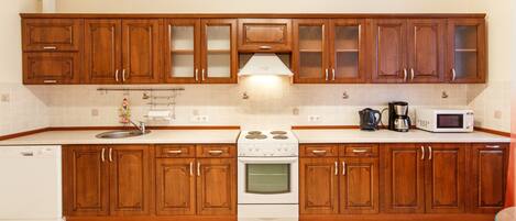 Luxury Apartment, 1 Bedroom | Private kitchen | Full-size fridge, microwave, stovetop, cookware/dishes/utensils