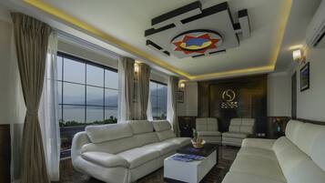 Presidential Suite, 1 Queen Bed, City View | Living area | Flat-screen TV