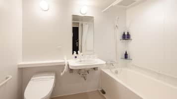 Een moderne badkamer met toilet, wastafel en bad.
