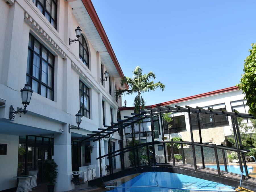 Outdoor pool, open 6 AM to 8 PM, pool loungers