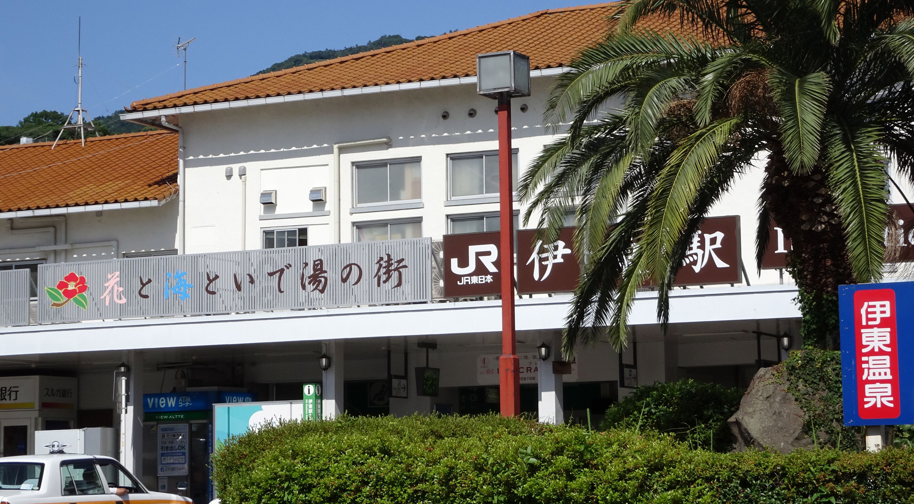 A building with signage for a hotel and a parking garage.